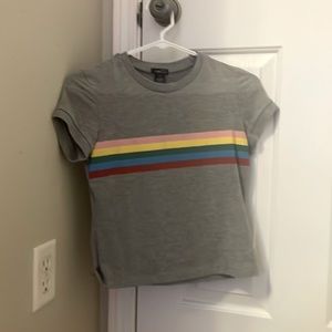 Grey shirt with rainbow stripes.